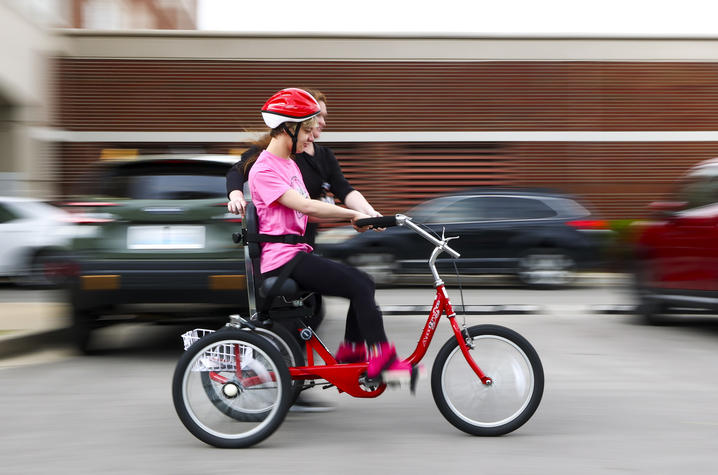 Child learning to ride a bike