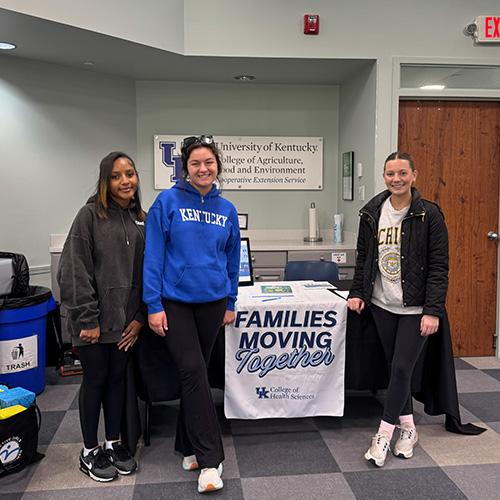 Three women at a Families Moving Together event