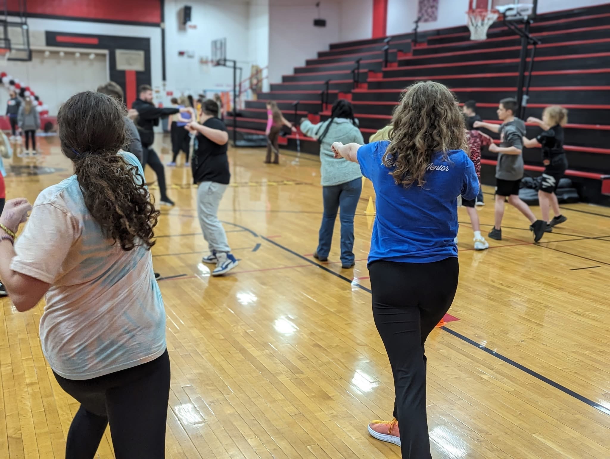 Movement mentor with students in gymnasium
