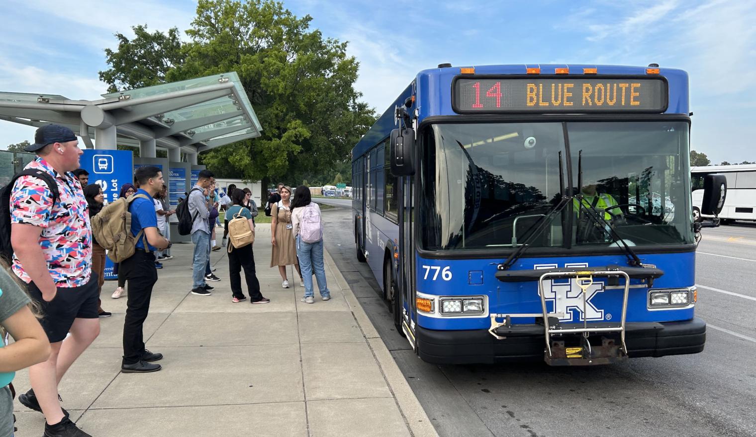 Students getting on university bus