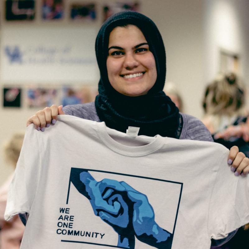 Student with We Are One Community Shirt