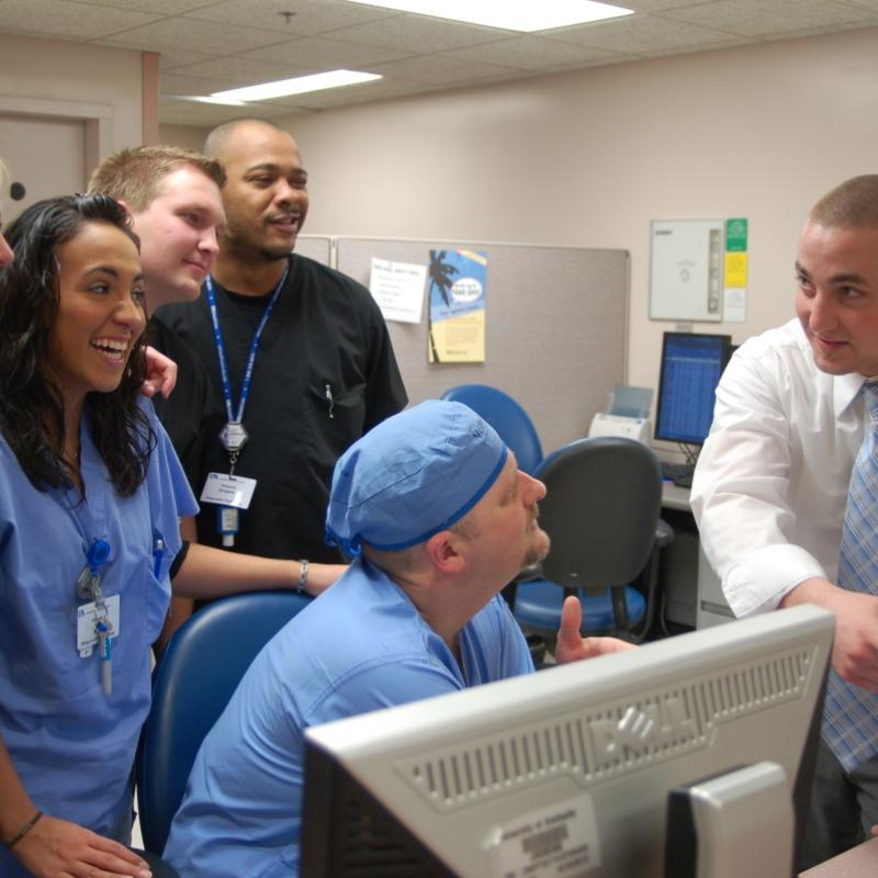 Students with Clinical Leader and Management Professor