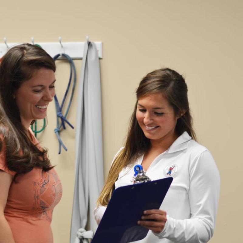 Kaylynne Glover (L) and PT student Katie Gross at the Samaritan's Touch Clinic