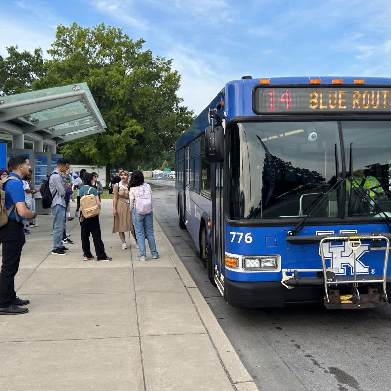 Students getting on university bus