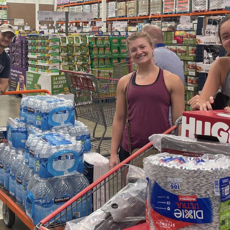 Students shopping for goods to assist families affected by flooding