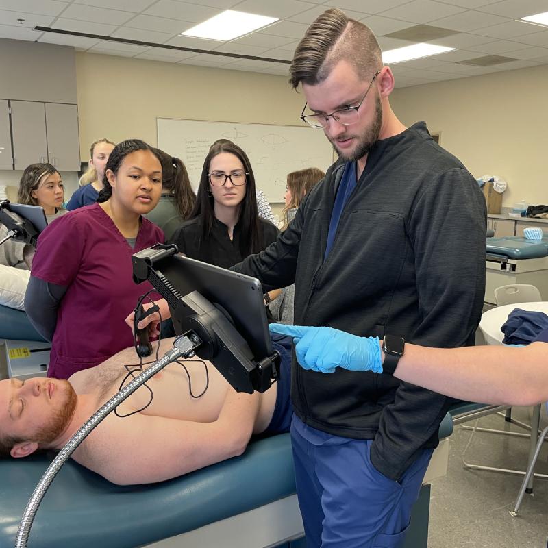 Students using mini-ultrasound equipment