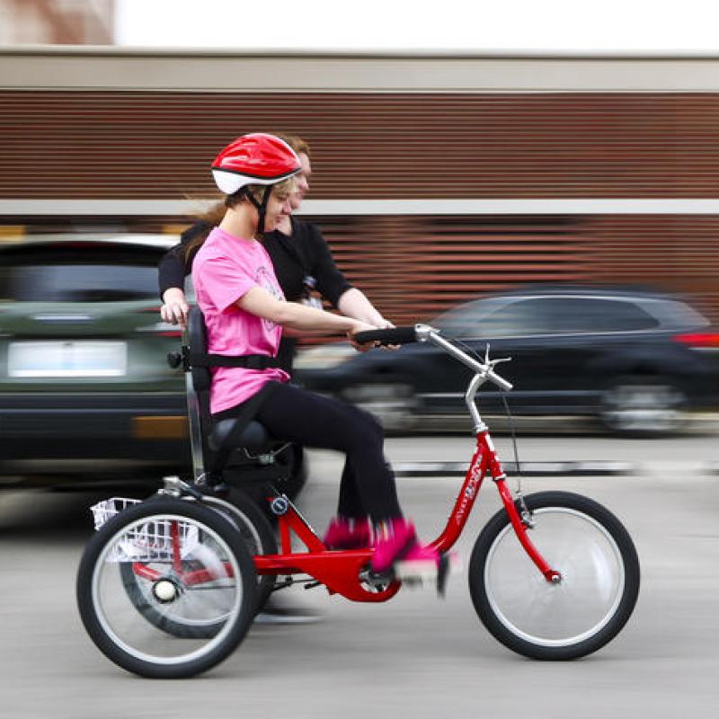 Child learning to ride a bike