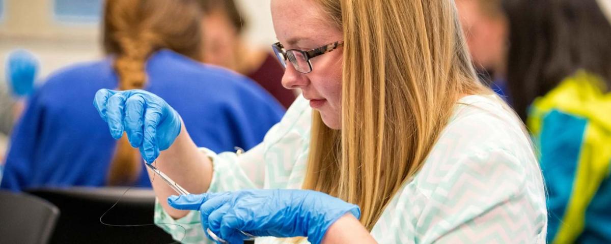 HHS Student in Lab Setting