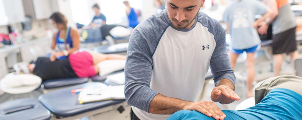 Physical Therapy student practicing in classroom