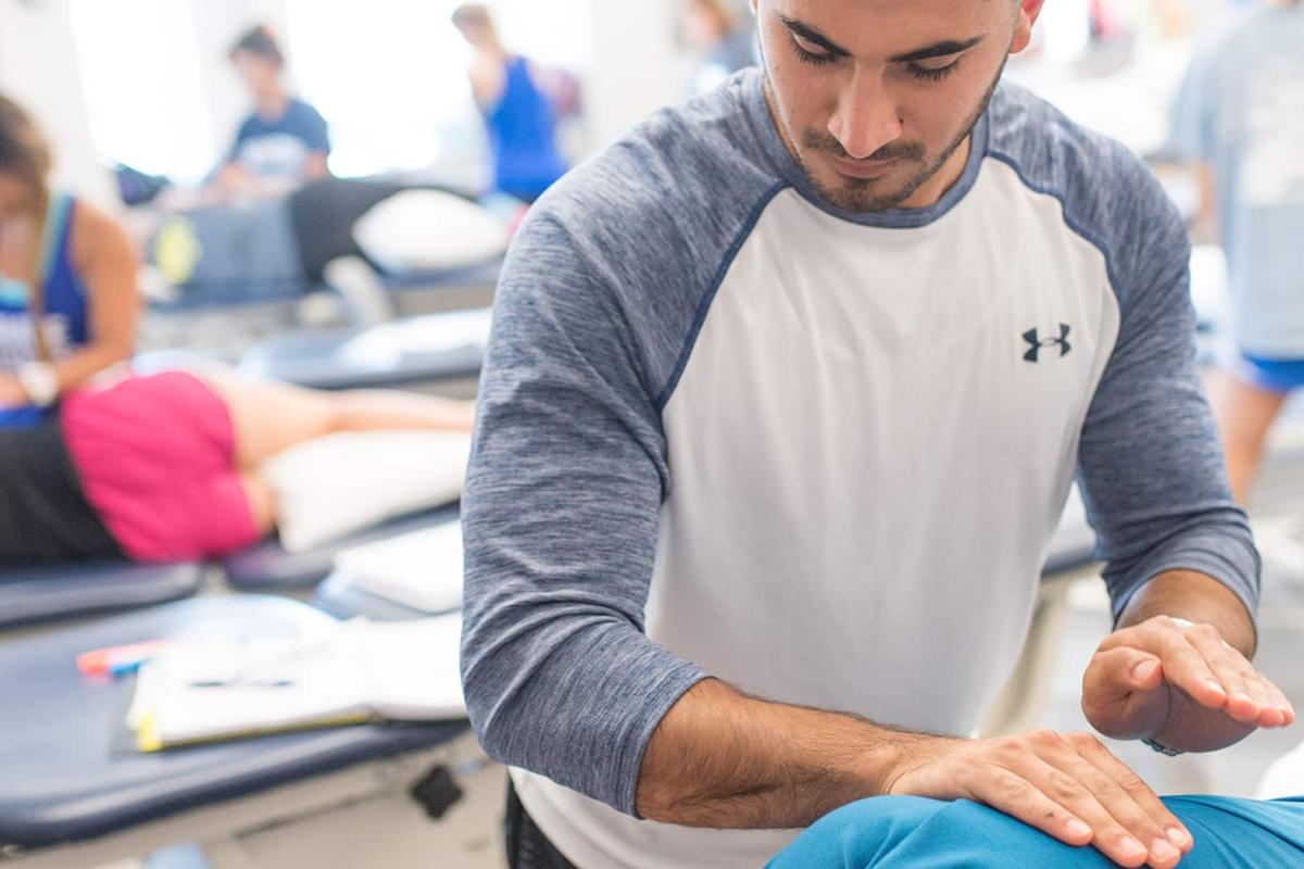 Physical Therapy student practicing in classroom