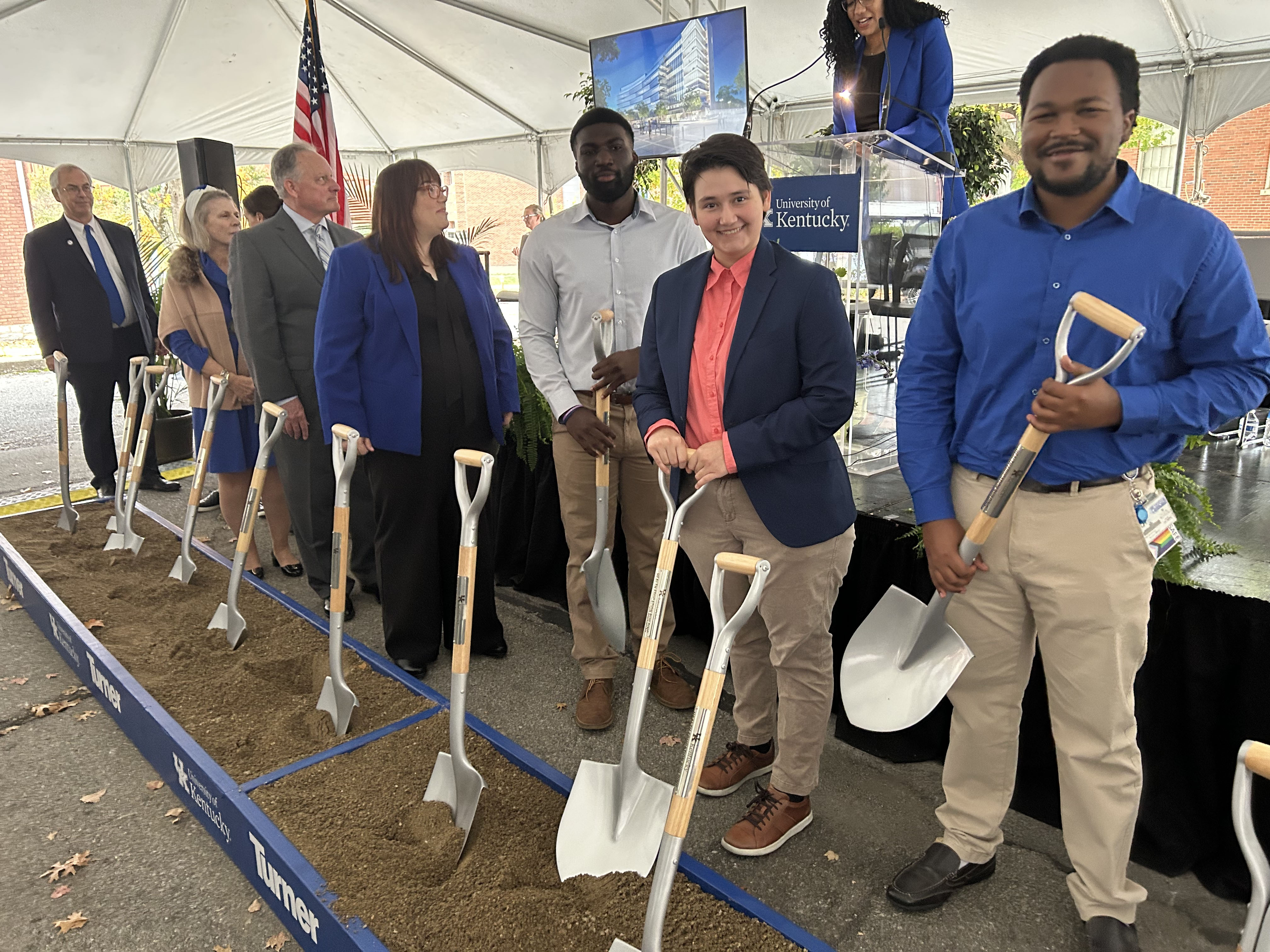 College Deans and students holding shovels to break ground