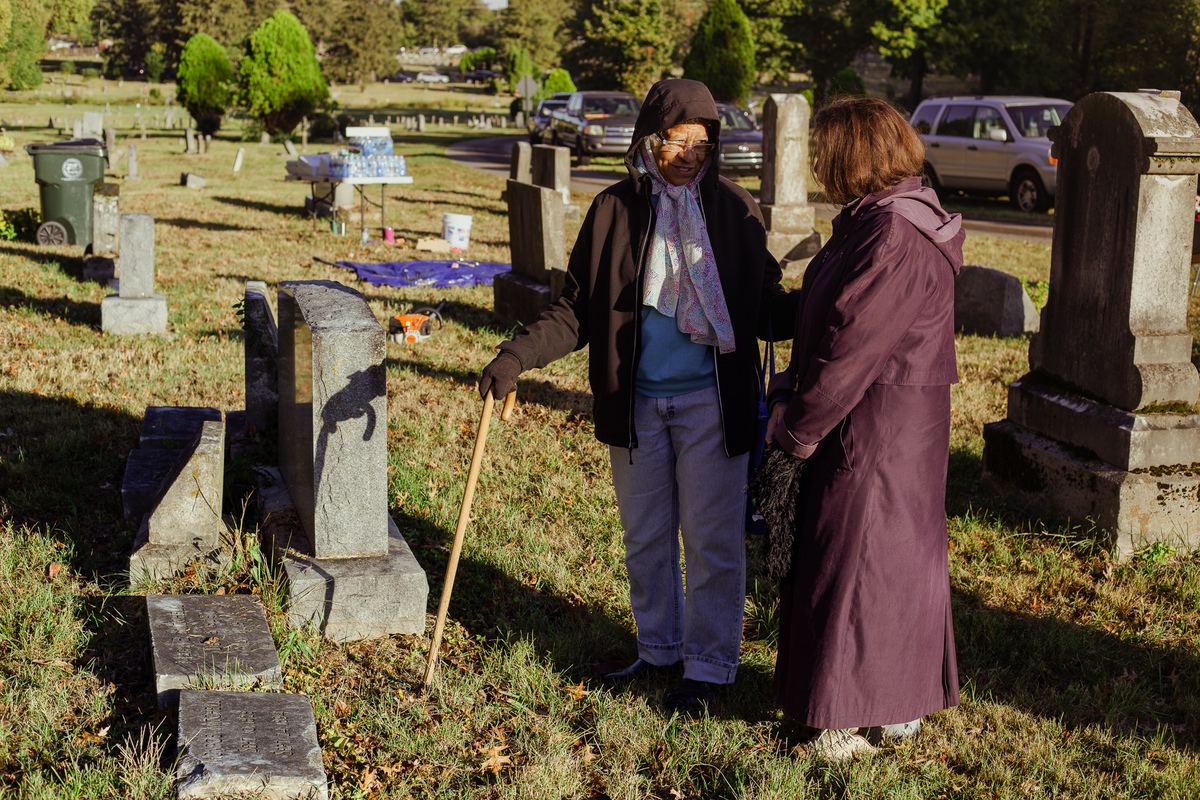 Brian Noehren and other cleaning the cemetery