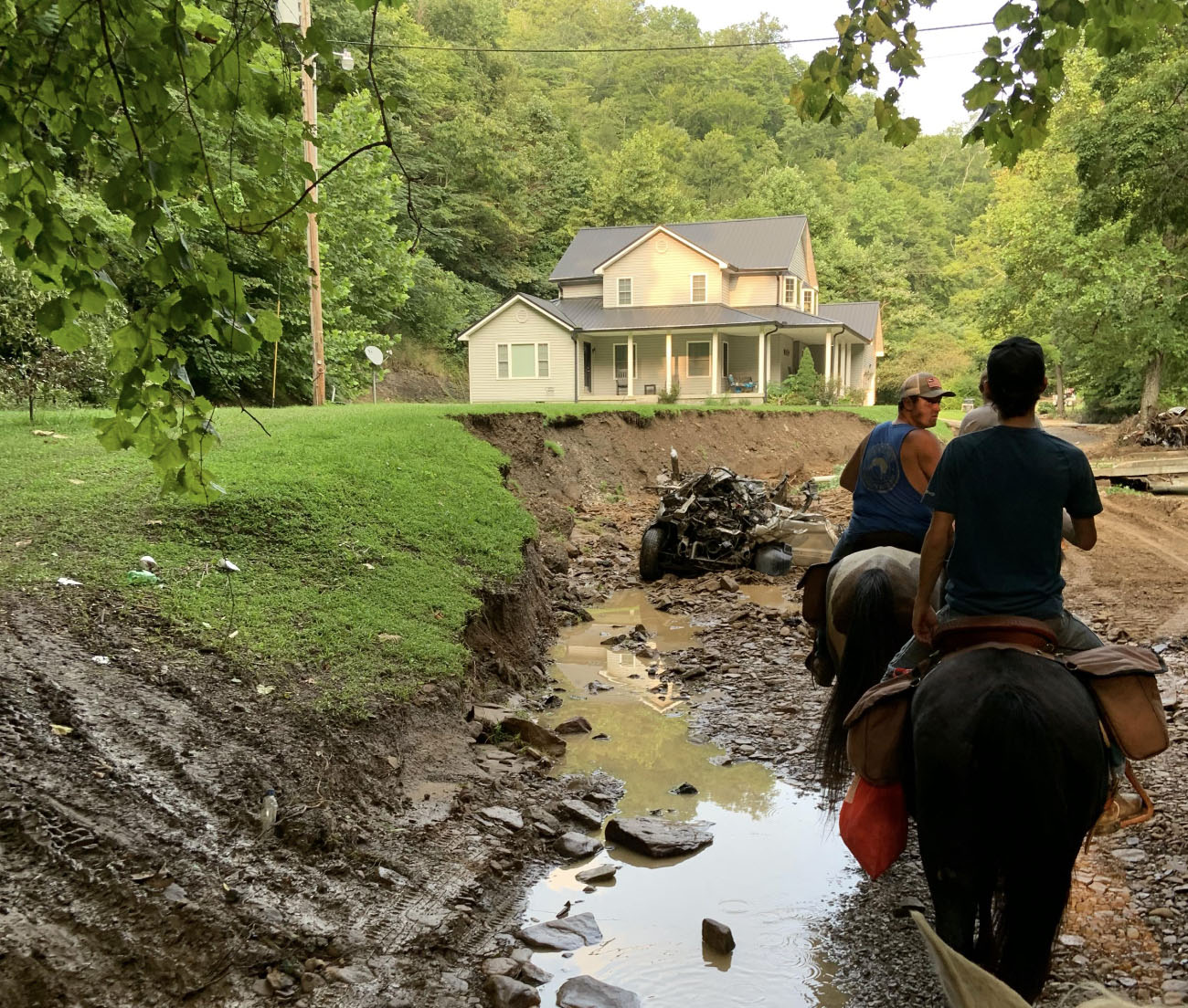 People riding horses during flood