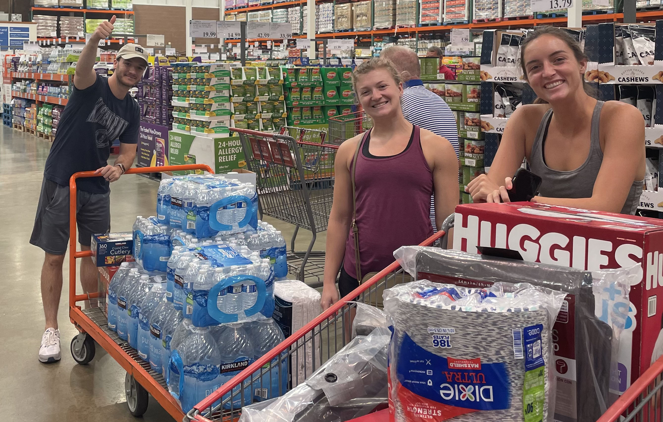 Students shopping for goods to assist flood victims