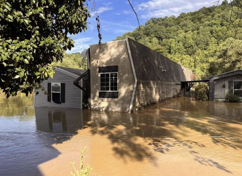 Mobile home flipped over from flood