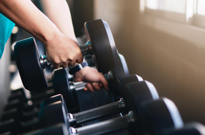 Lifting Dumbbells in gym