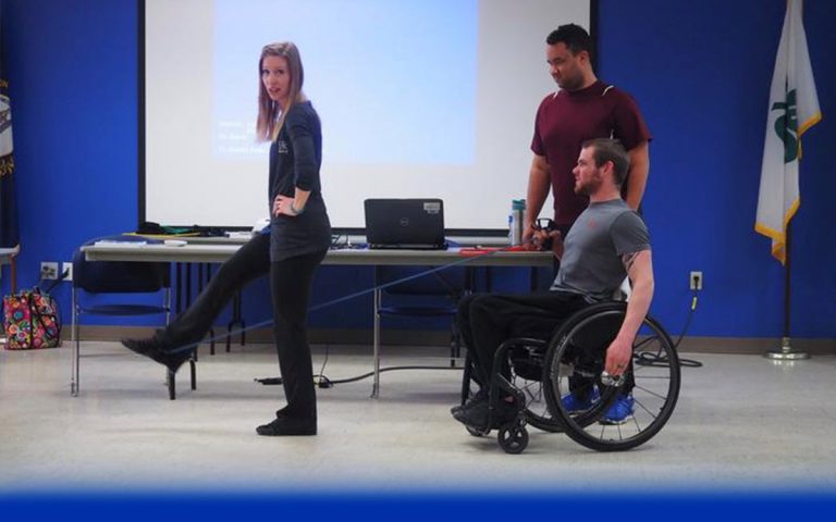 Man in wheelchair receiving therapy