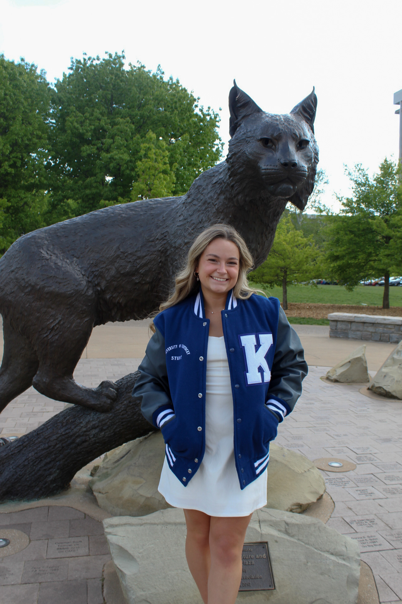 Rachel Woods next to wildcat statue