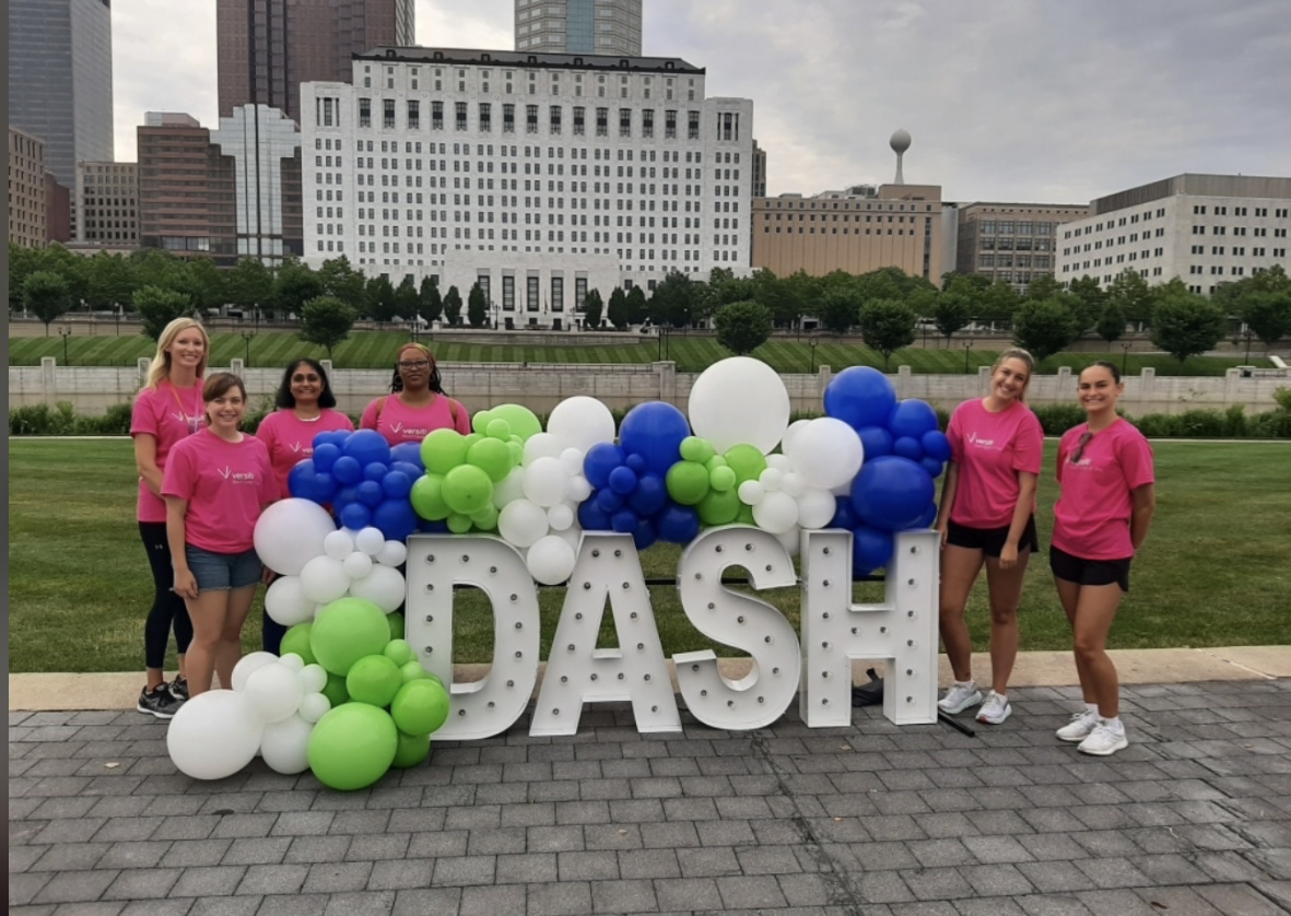 Students around DASH sign